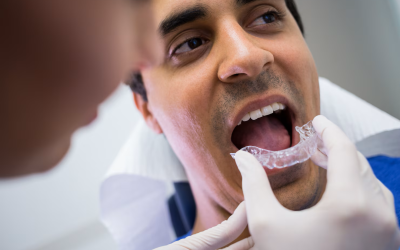 dentist assisting patient wear invisible braces